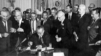 Lyndon Johnson signing Civil Rights  Act
