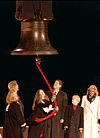 [PHOTO:  Clintons & Gores standing by the Liberty Bell replica]