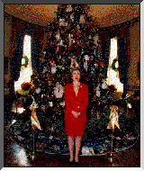 [PHOTO: Mrs. Clinton standing in front of the Blue Room Christmas tree]