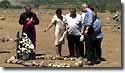 Photo of President Clinton at gravesite of mudslide victim, Casita Volcano Area, Nicaragua.