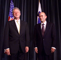 President Clinton stands with Prime Minister Janez Drnovsek of Slovenia in the Grand Hall of the Presidential Palace.