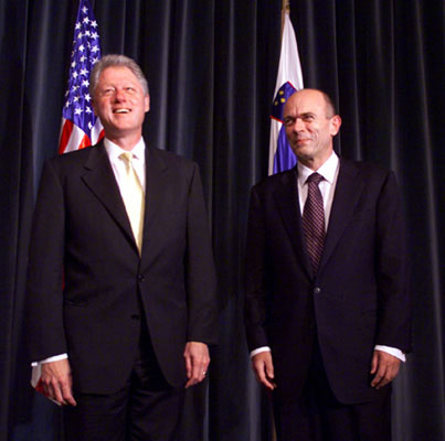 President Clinton stands with Prime Minister Janez Drnovsek of Slovenia in the Grand Hall of the Presidential Palace.