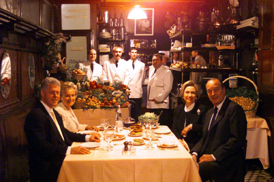 The President and the First Lady enjoy a private dinner with President and Mrs. Jacques Chirac at L'Amis Louis in Paris.