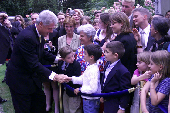 President Clinton greets a young admirer outside the ambassador's residence in Paris.