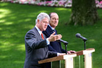 President Clinton answers a question during a press conference in the garden of Elysee Palace.