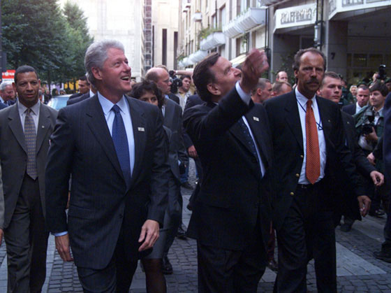 President Clinton and Chancellor Schroeder admire the cheering crowds on the streets of Cologne.