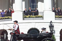 President Clinton and guests watch a reenactment of President John Adams' arrival at the White House by horse and carriage in honor of the 200th anniversary of President Adams first arrival here on November 1, 1800.