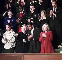 Photograph: First Lady Hillary Rodham Clinton and guests applaud during the President's address.