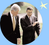 Chief of Staff John Podesta briefs the President as they walk to the Oval Office.