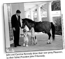 John and Caroline Kennedy show their new pony, Macaroni, to their father, President John F. Kennedy.