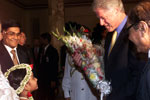 President Clinton is presented with flowers upon his arrival at the official dinner at Bangabhawan, Bangladesh.