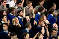 School children cheer President Clinton during his speech at the Odyssey Center