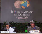 Italian Prime Minister Massimo D'Alema seated beside President Clinton at the 