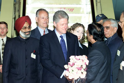 President Clinton and daughter Chelsea are greeted by Indian officials upon their arrival at Palam Air Force Station, New Delhi.