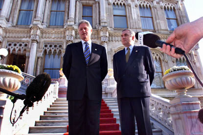 President Clinton stands on the steps of Ciragan Palace with Ireland Prime Minister Bertie Ahern before their meeting.