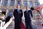 President Clinton stands on the steps of Ciragan Palace with Ireland Prime Minister Bertie Ahern before their meeting.