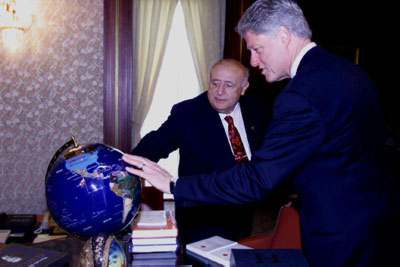 President Demirel and President Clinton employ a globe in their discussions at the Presidential Palace.