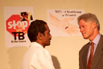 President Clinton greets Dr. Akbar Yazdani, Medical Officer, at Mahavir Trust Hospital.  Hyderabad, India. 
