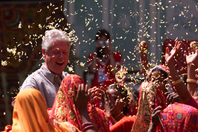 Naila village women shower the President with flower petals as part of a traditional ceremony.