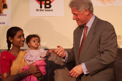 President Clinton greets Pushpalatha Balakrishna and her 9 month-old daughter Sandhya at Mahavir Trust Hospital.  Hyderabad, India. 