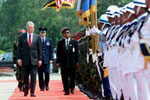 President Clinton reviews the Honor Guard during the arrival ceremony at Zia International Airport, Bangladesh.
