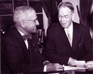 Ira Smith (right) confers with President Harry Truman (left) about his mail.